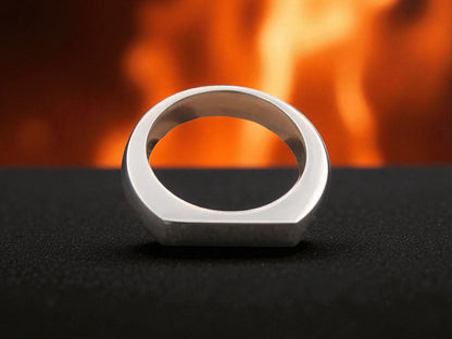 Close-up of modern titanium ring featuring flat top and smooth interior finish