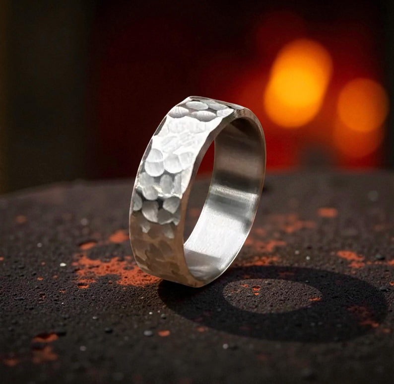 Hammered texture adorns this titanium wedding ring, blending elegance with a contemporary style.