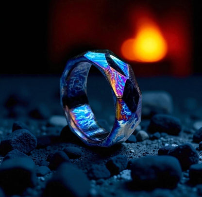 Polished titanium ring with reflective facets and fiery background lighting