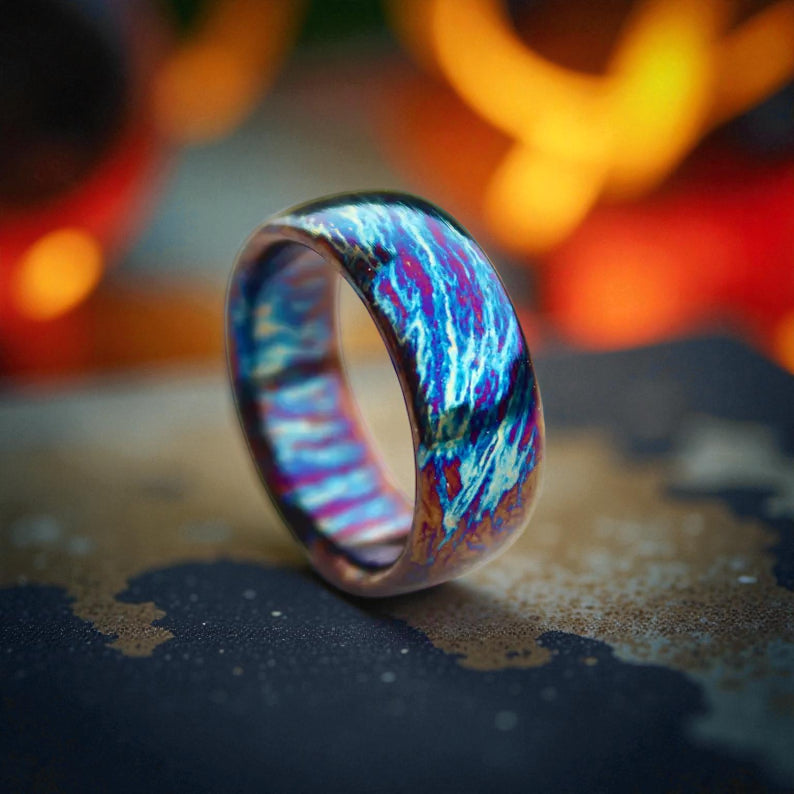 Vibrant titanium dome ring with blue and magenta marbled finish