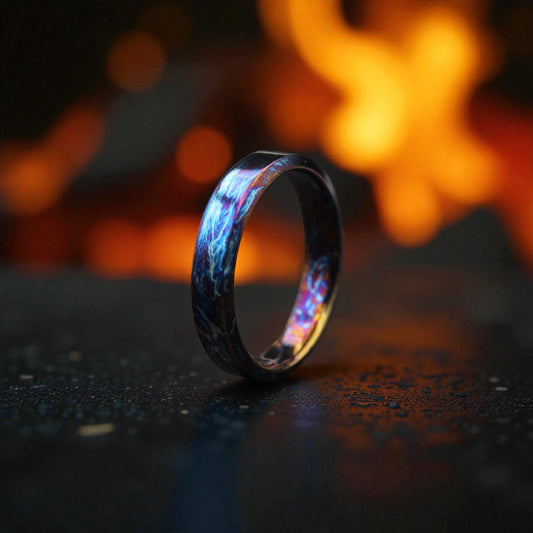 Close-up of titanium ring glowing with blue and bronze lightning design